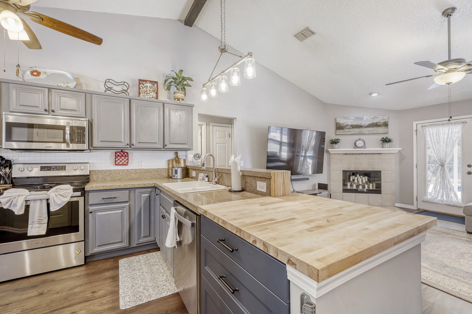 Gourmet open kitchen with fireplace views