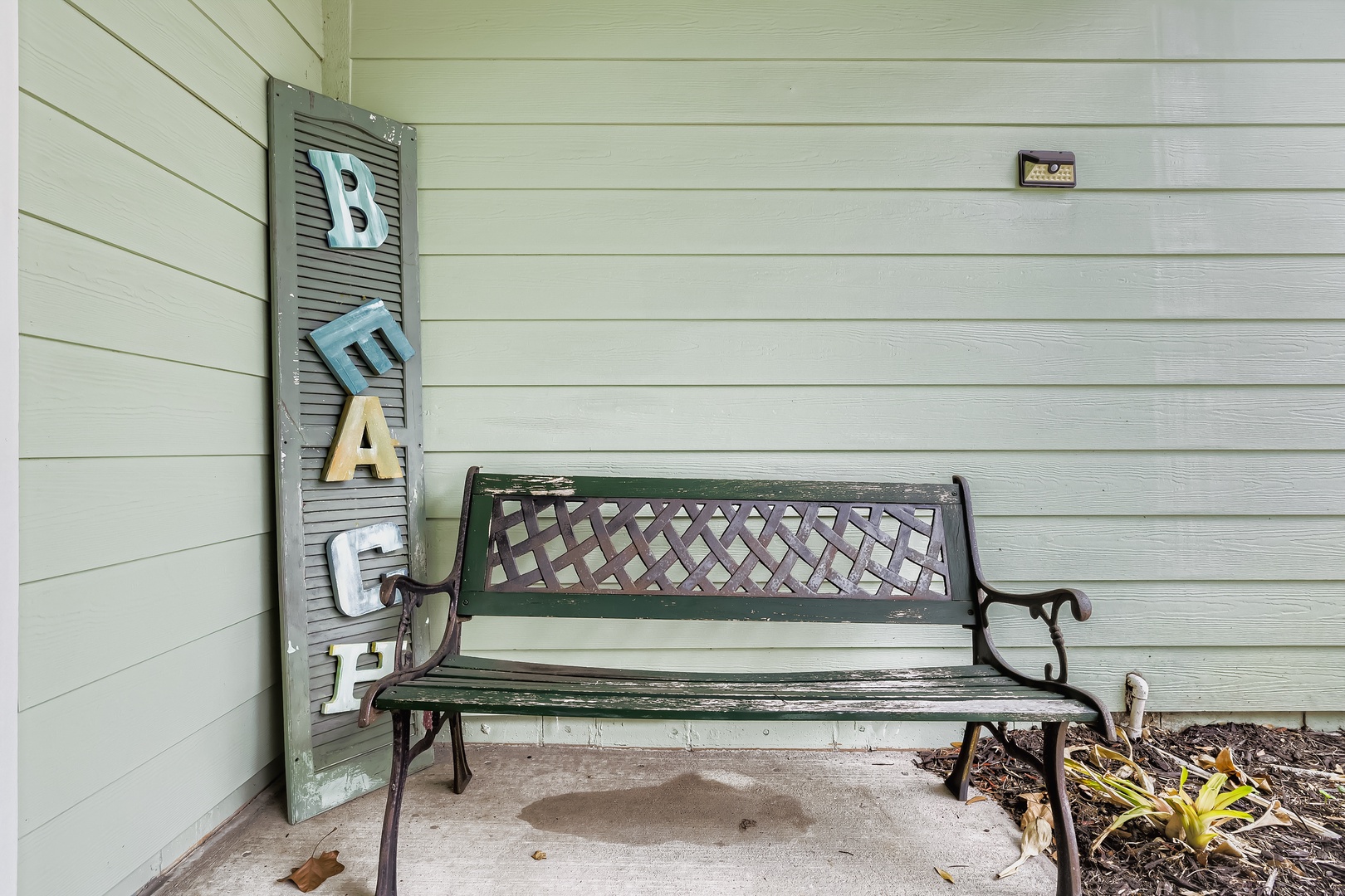 weathered bench and vintage 'BEACH'  welcoming!