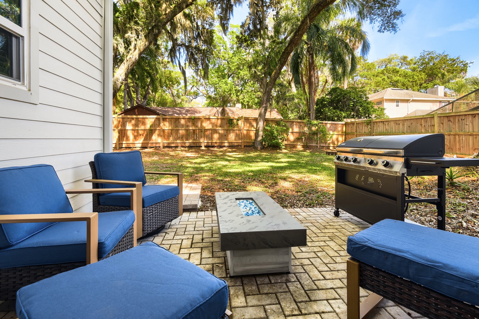 Cozy Backyard Patio with Fire Pit & Grill
