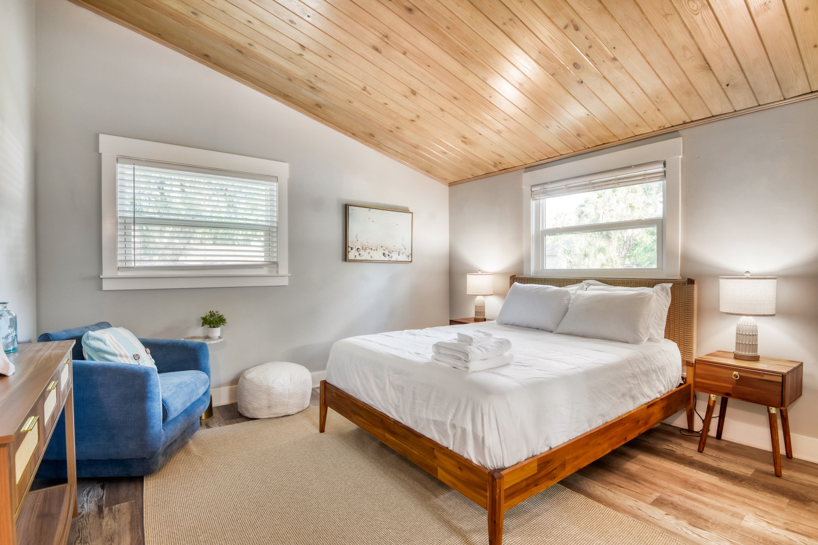 Cozy Queen Bedroom with Wood Ceilings & Reading Chair