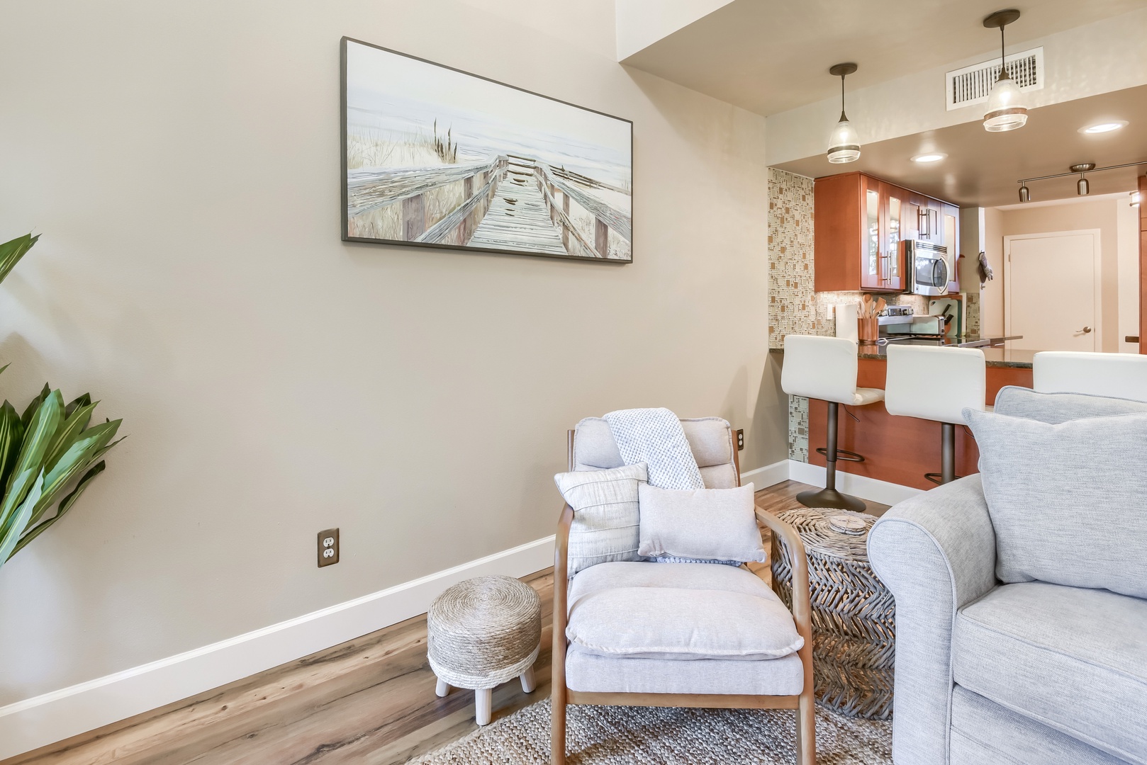 Living area flows to the breakfast bar for easy open-concept living
