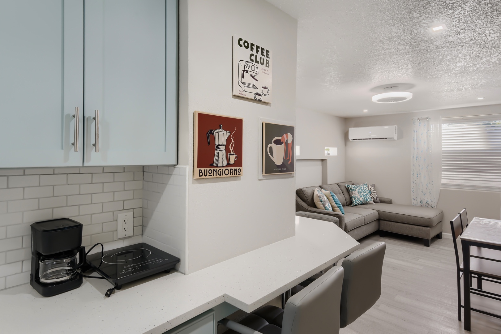 Coffee maker and induction cooktop at the breakfast bar