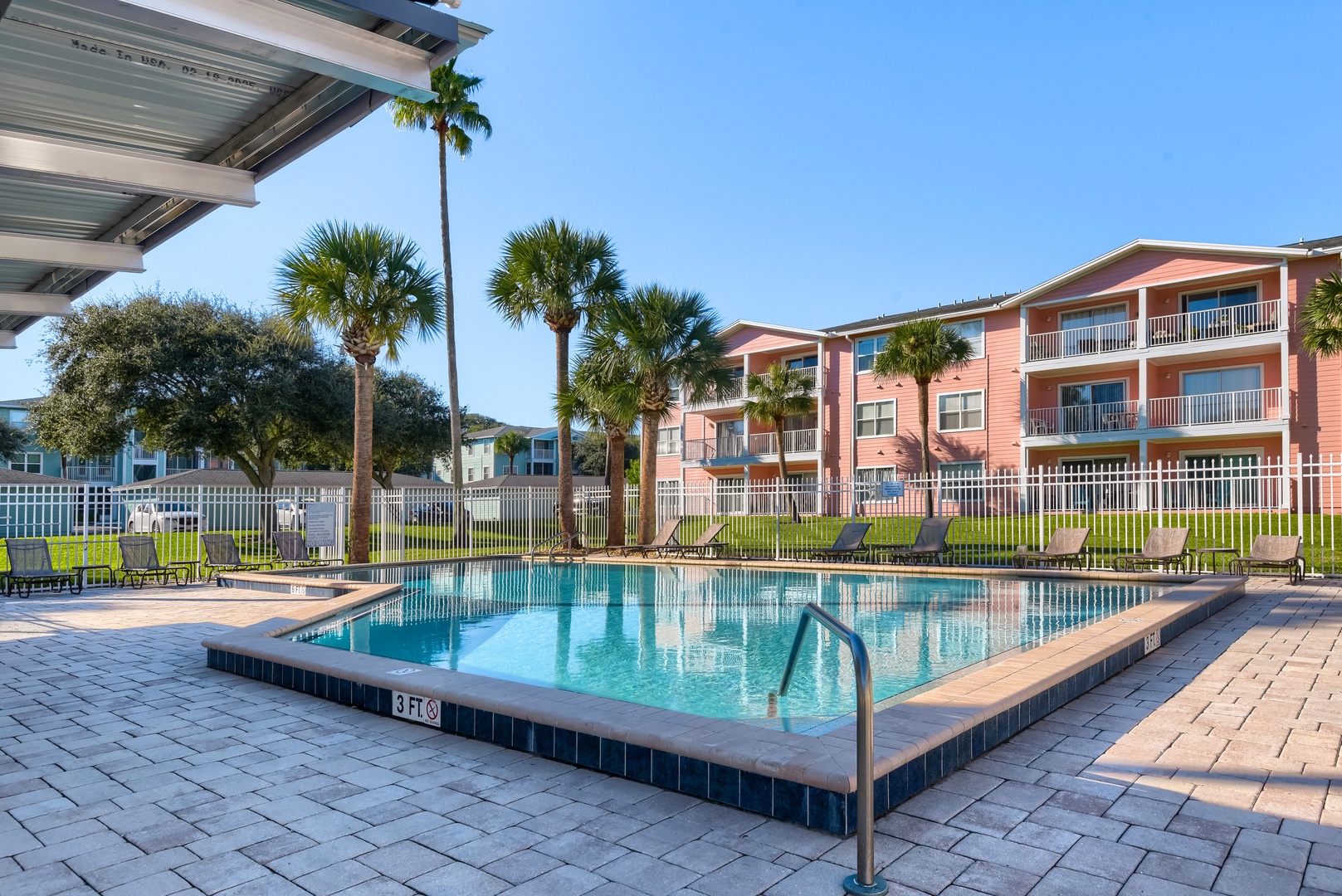 Swim, soak up the sun or relax poolside under the palms