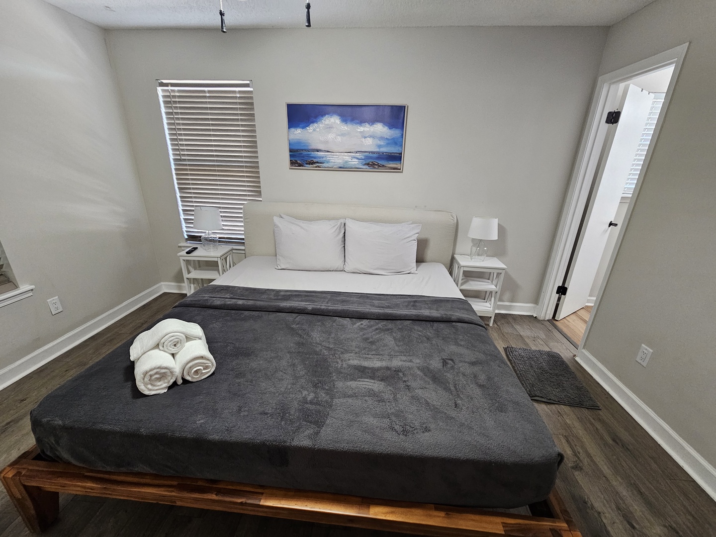 Plush King bed with attached private bathroom