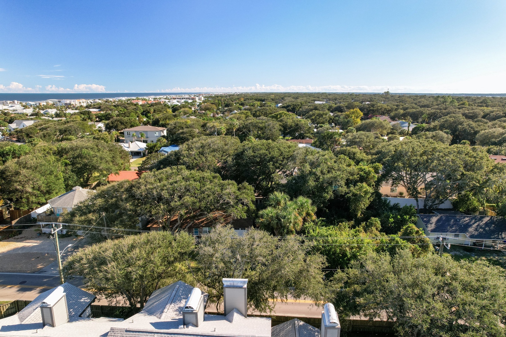 Sweeping view over the oak canopy to the coastline