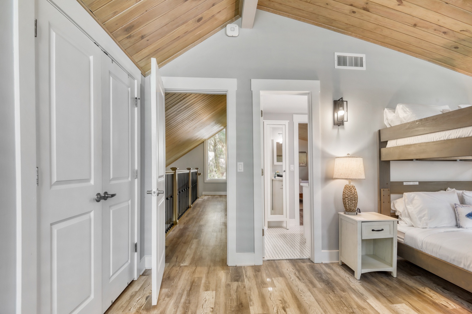 Dreamy Queen Bunk Room Under Warm Wood Ceilings