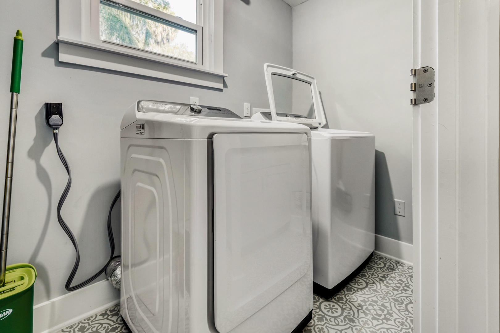 Laundry room featuring modern machines.
