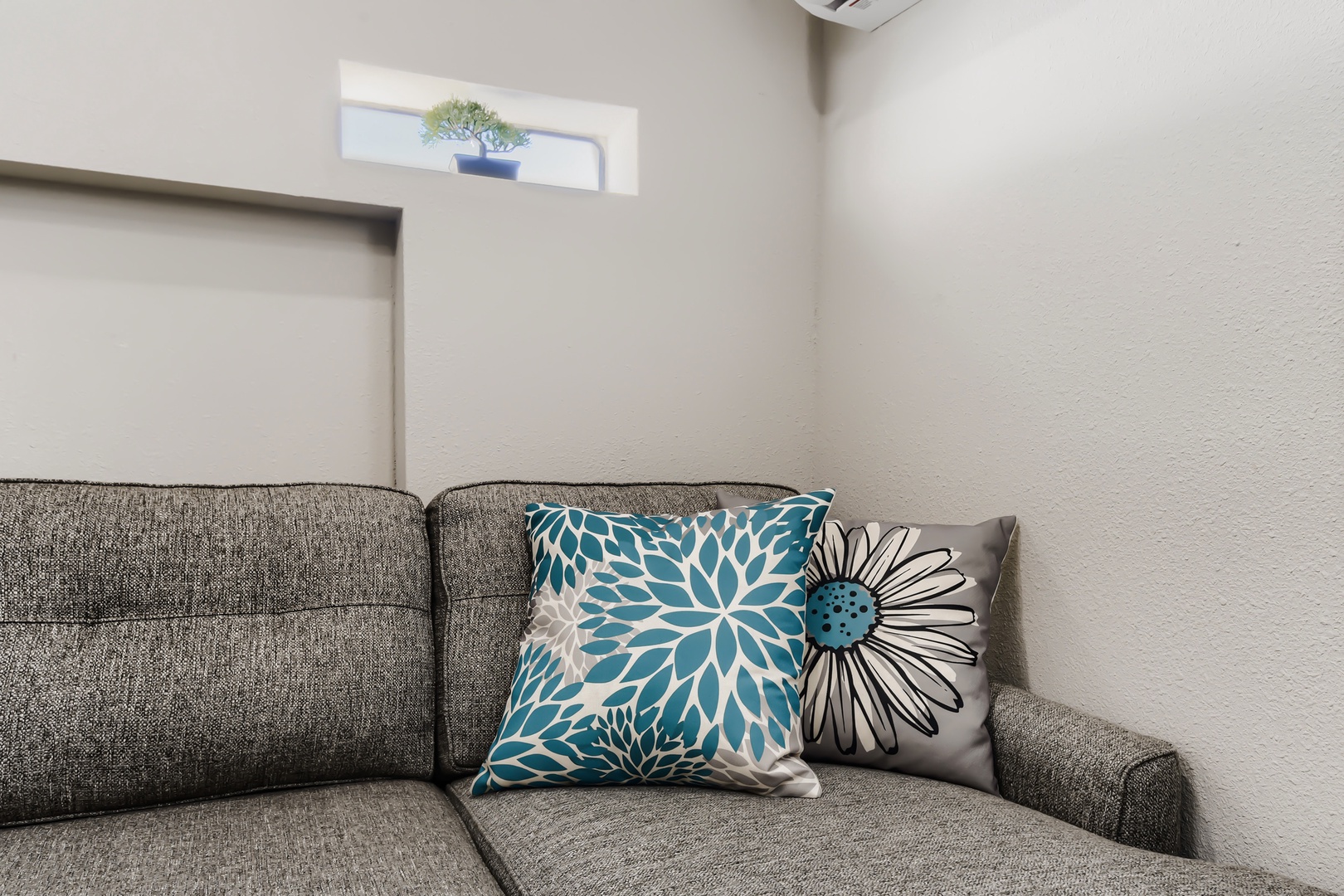 Sectional sofa detail with accent pillows