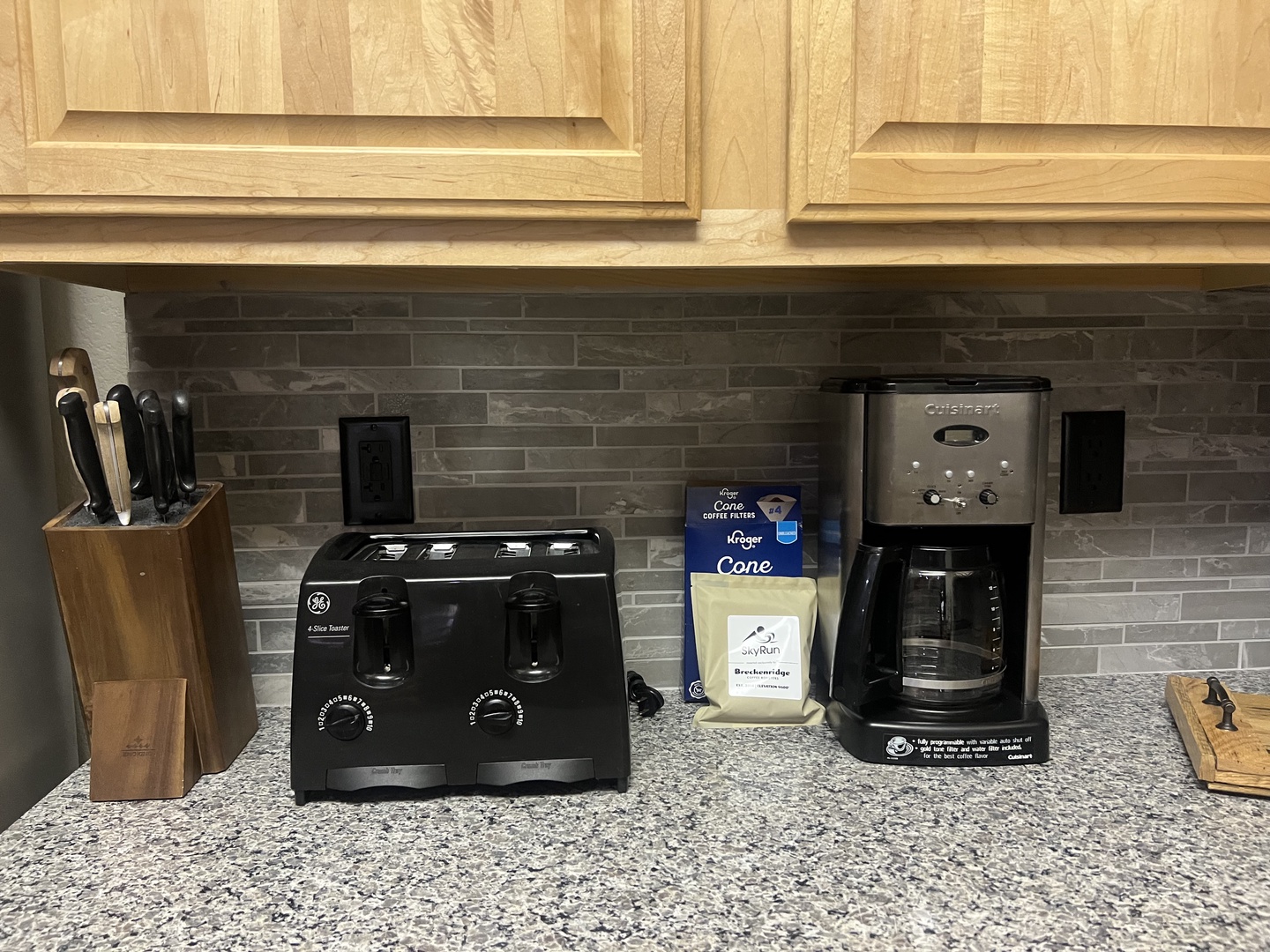 Your morning coffee ritual is ready. A well-stocked kitchen counter with fresh beans, a quality coffee maker, and toaster ensures you start each day at your own pace.