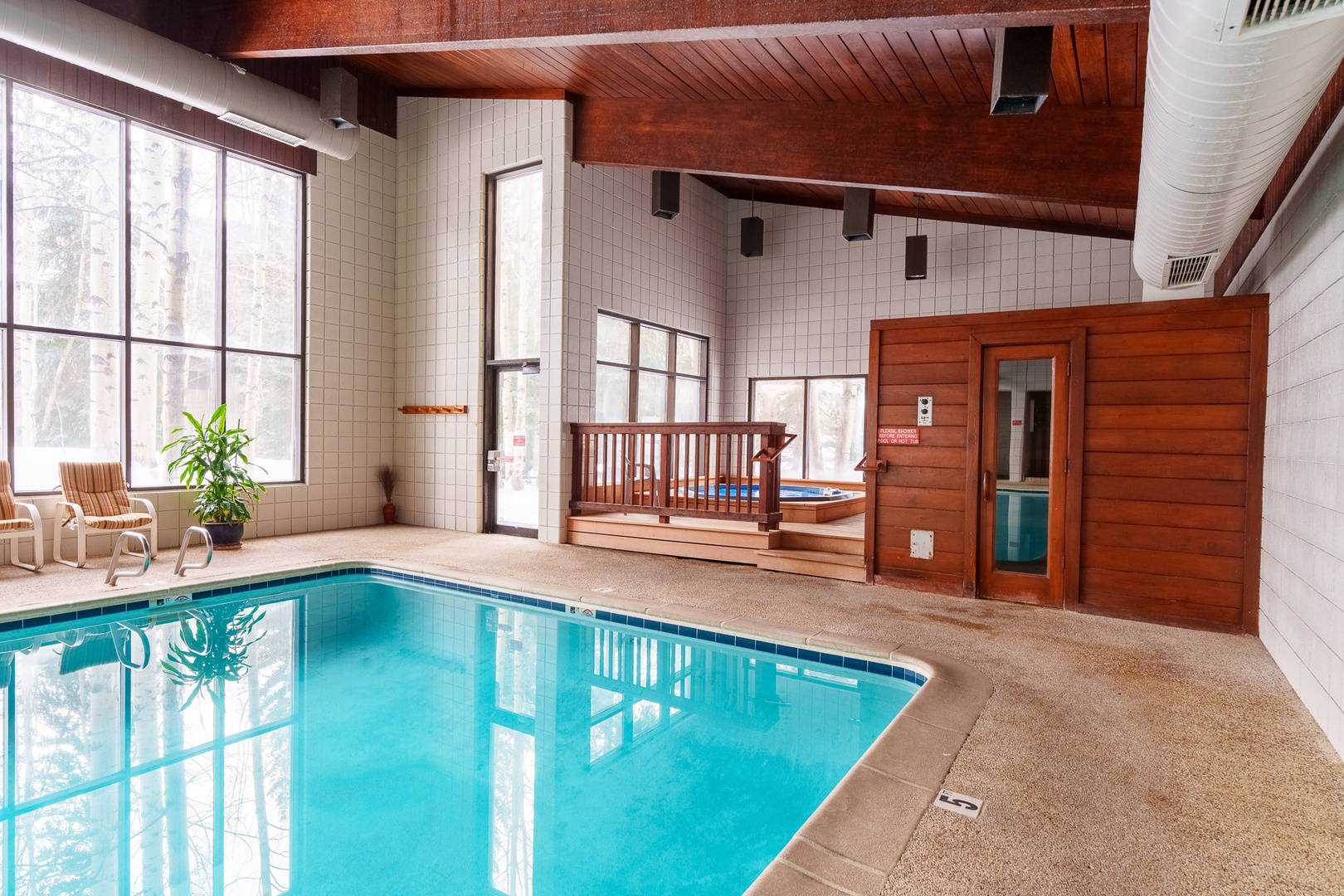Your private indoor pool sanctuary awaits, complete with a hot tub and sauna for ultimate relaxation.