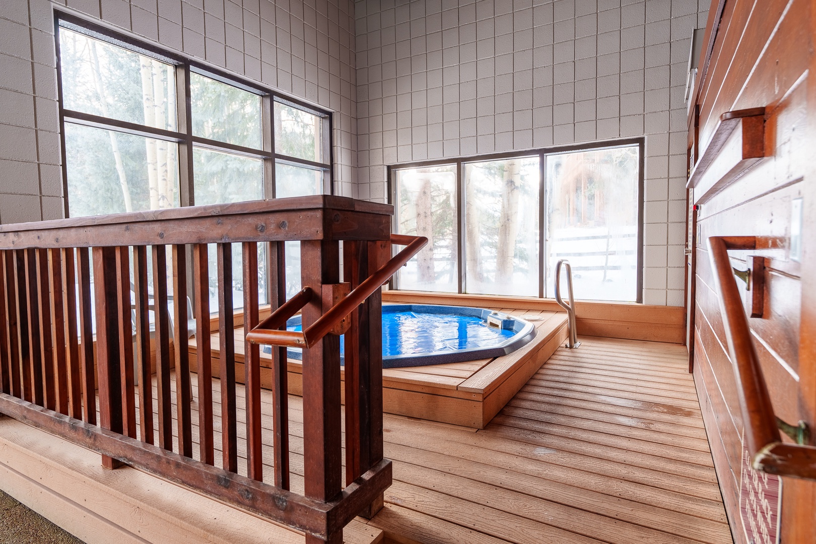 Soak away your stress in your private hot tub surrounded by warm wood and natural light.