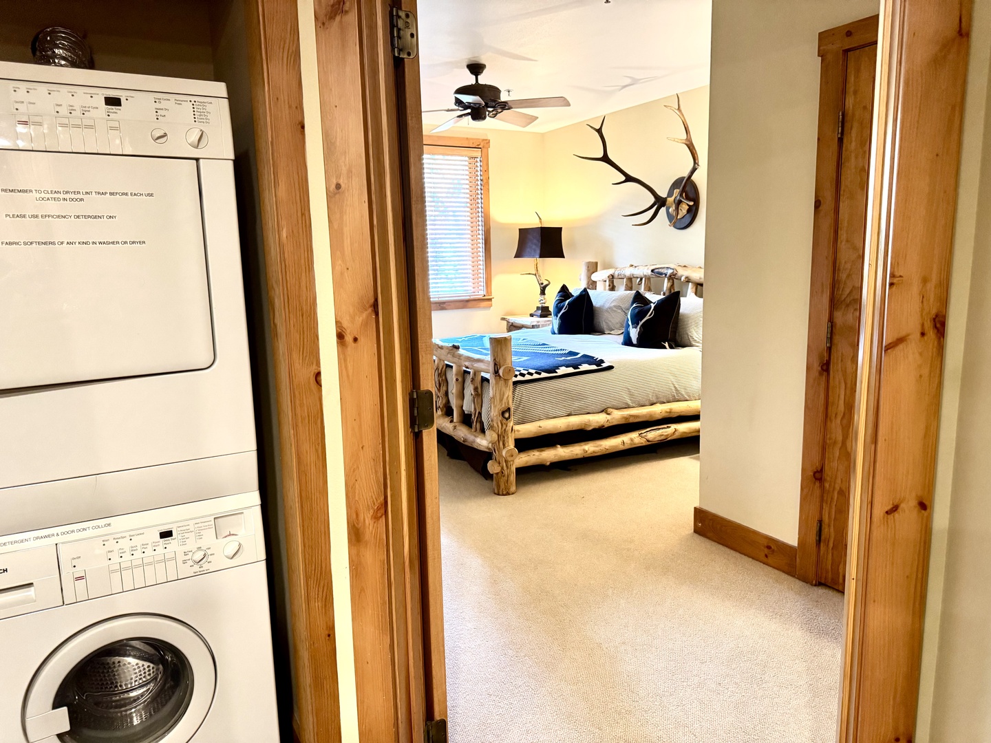 Step into your rustic retreat where a handcrafted log bed invites restful nights under a cozy ceiling fan. In-unit laundry makes your stay effortless, while unique mountain-inspired décor adds authentic character to your getaway.