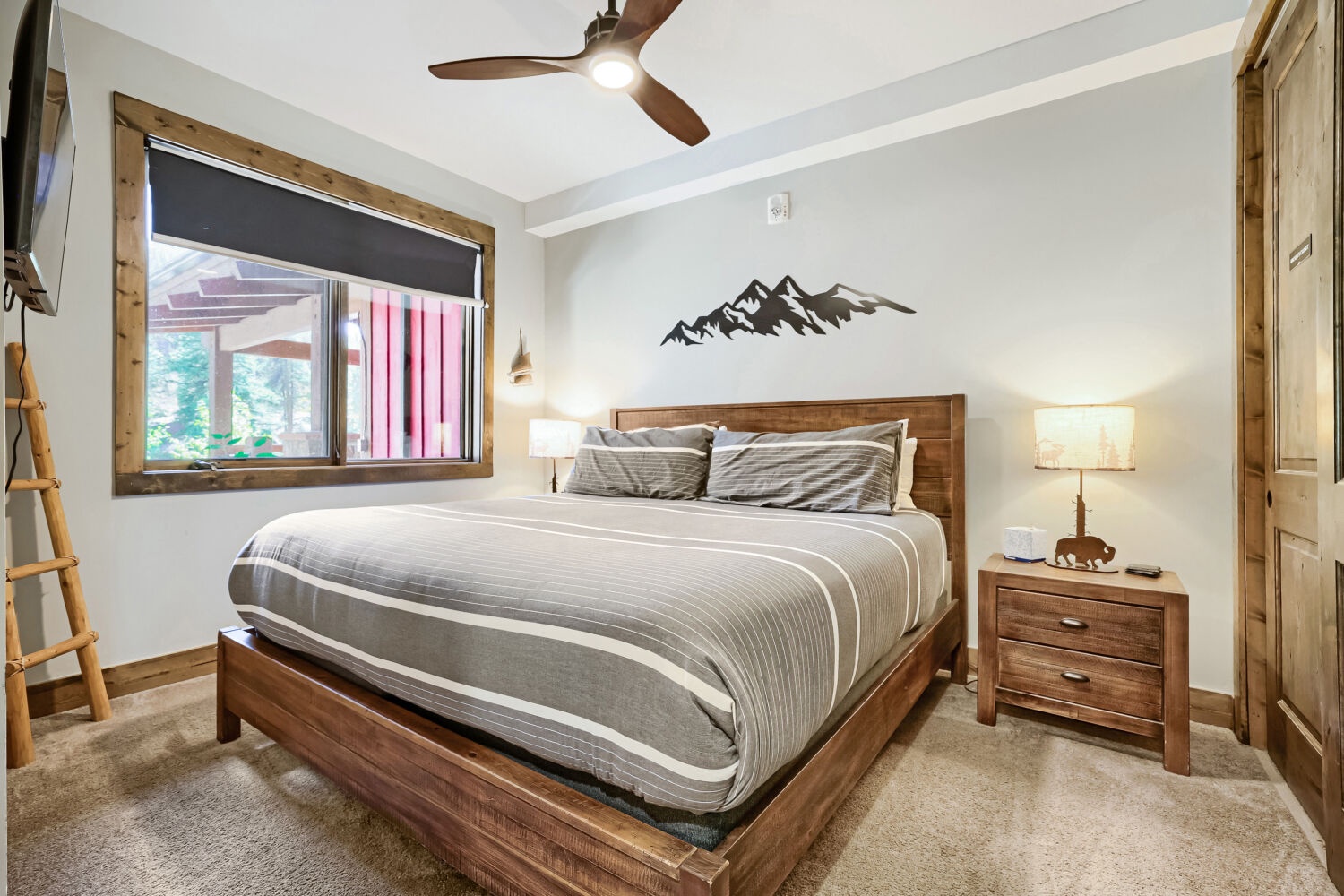 Sink into this plush bed after a day of mountain adventures. Warm wood tones, soft lighting, and alpine-inspired décor create a cozy retreat where restful sleep comes naturally.