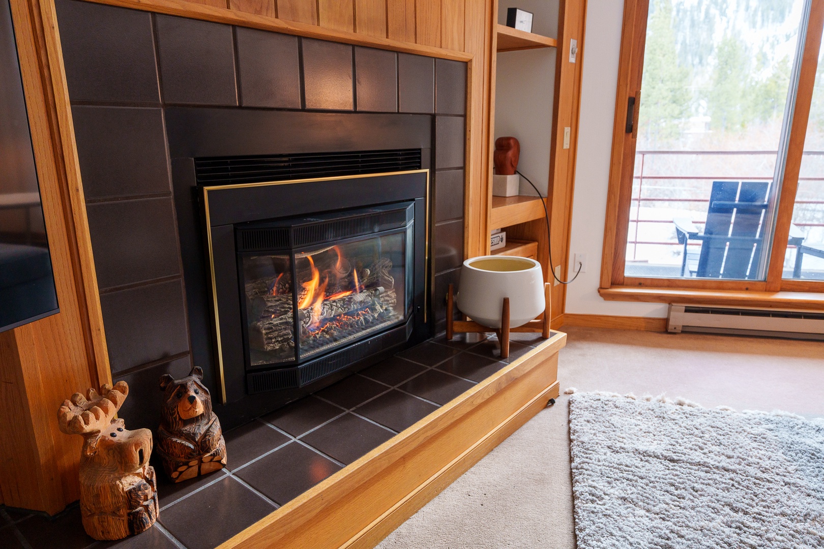 Cozy up by your crackling fireplace with mountain views from your private deck - the perfect retreat for relaxation.