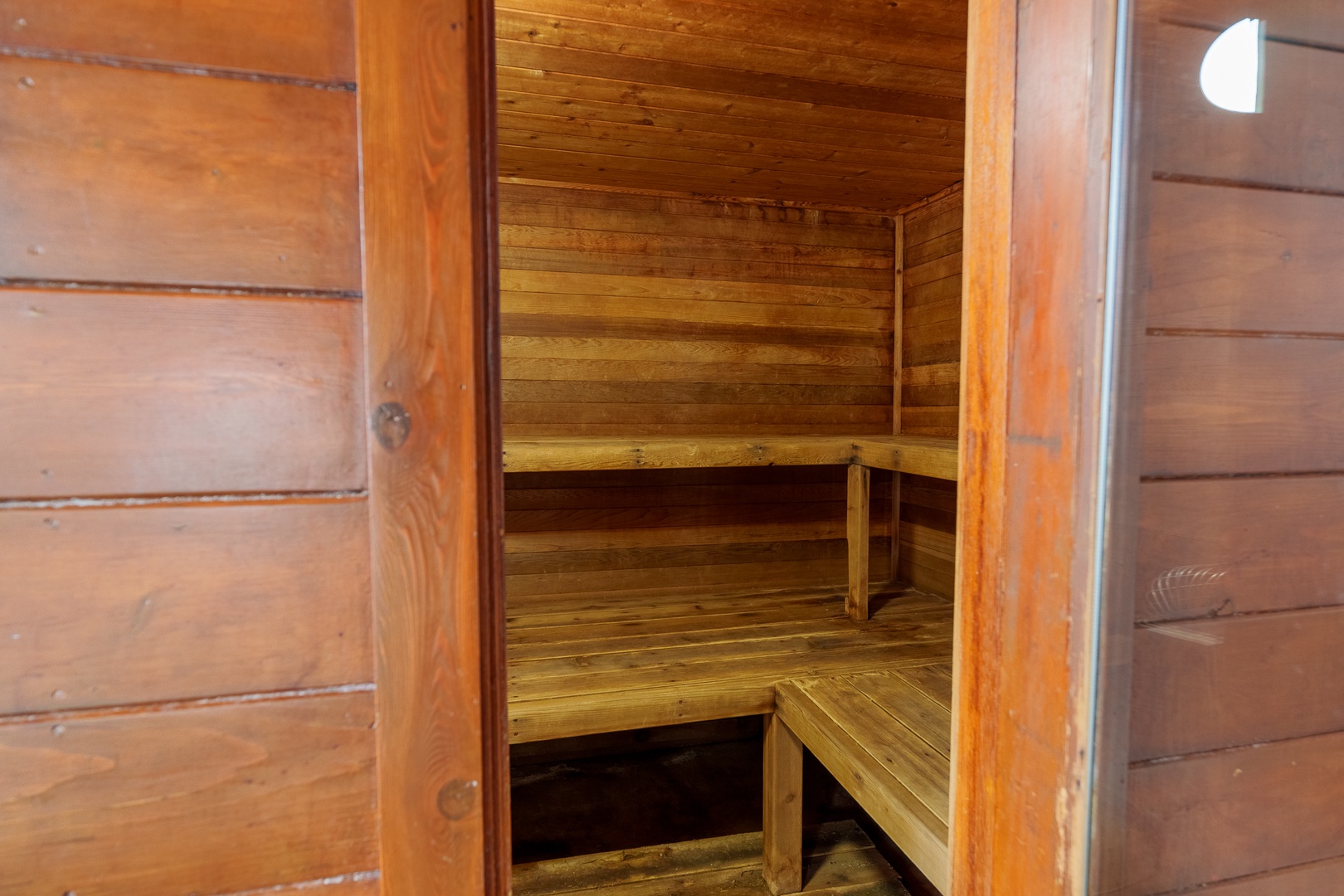 Step into your private wooden sauna where warm cedar surrounds you, creating the perfect space to unwind and rejuvenate after your adventures.