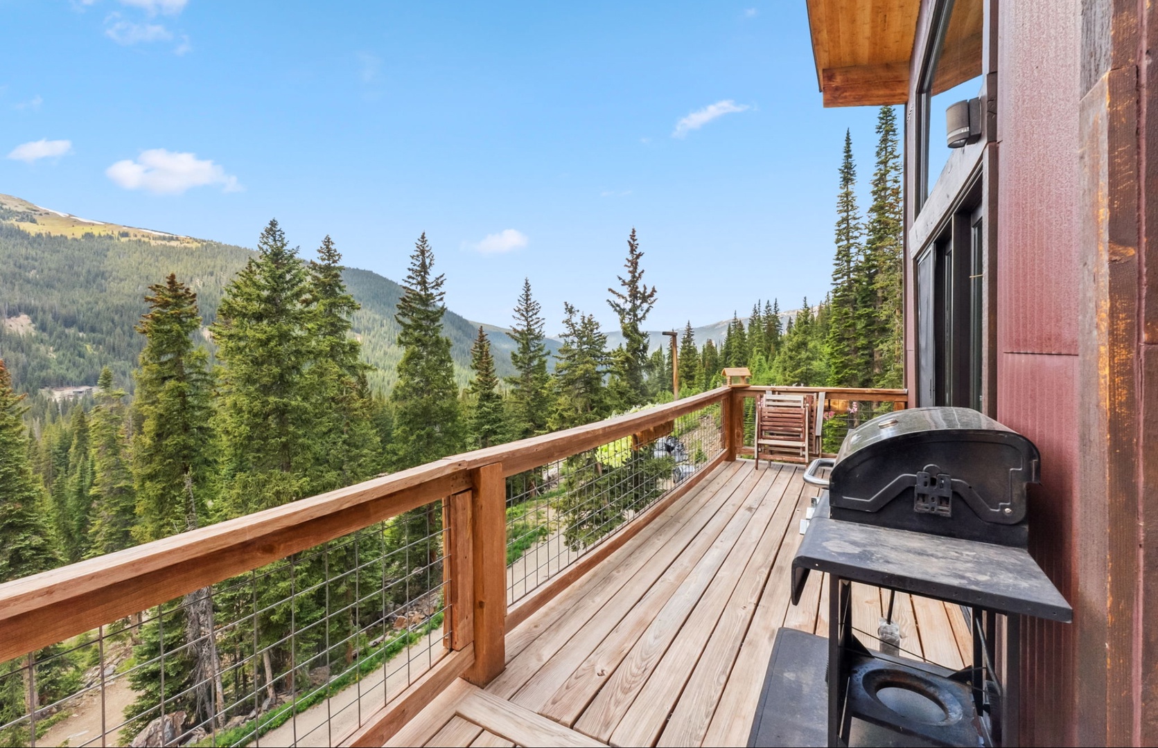 Step onto your private deck where towering pines frame mountain views, fresh alpine air fills your lungs, and evenings promise unforgettable sunsets over the peaks.