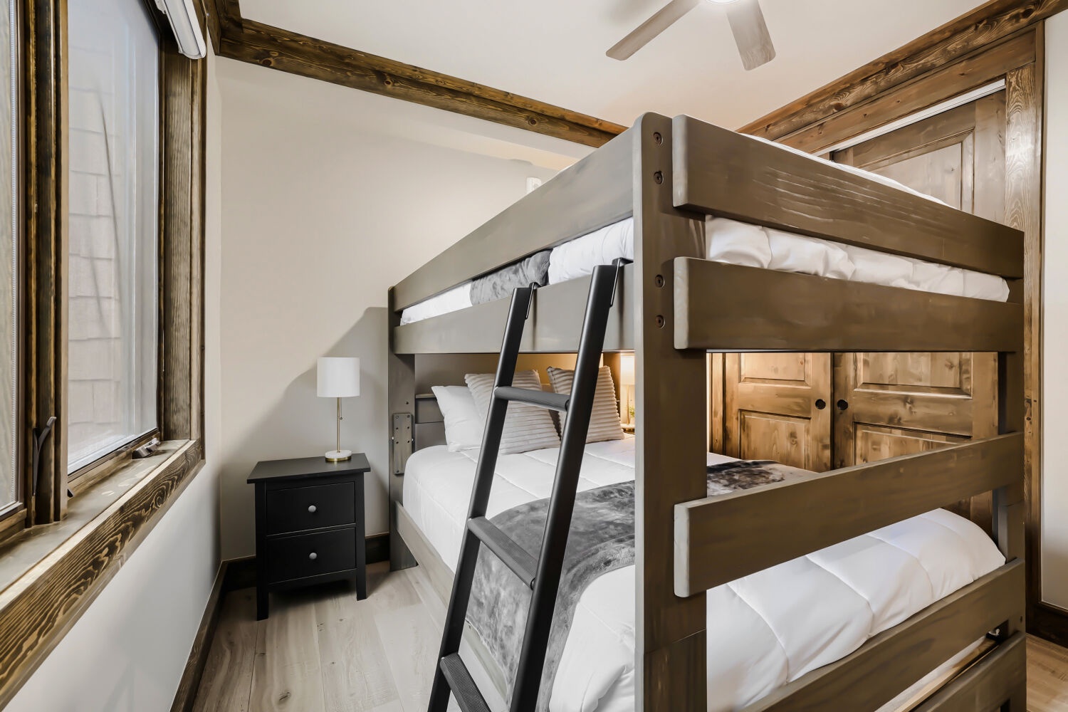 Your cozy bunk room awaits, with solid wood frames and fresh linens ready for restful nights. Rustic beams and warm finishes make this the perfect retreat for families or friends.
