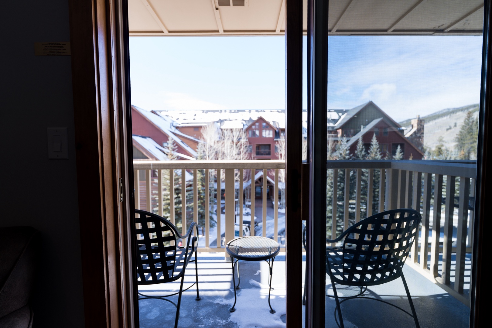 Step onto your private balcony and enjoy the crisp mountain air with comfortable seating for two, perfect for your morning coffee or evening relaxation.