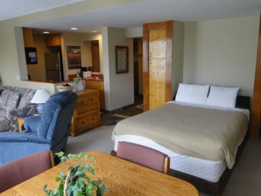 The Murphy bed pulls down from the wall and is a real queen size bed.
