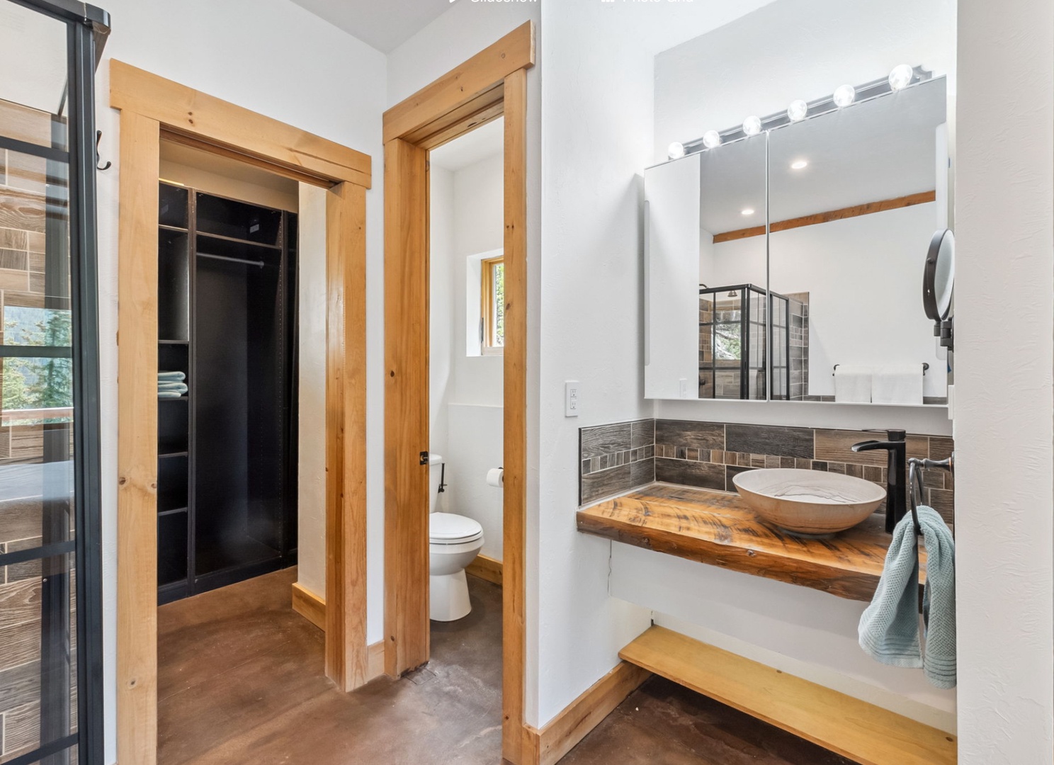 Step into your private bathroom with warm wood accents, a sleek vessel sink, and a spa-like walk-in shower—everything you need to refresh and unwind in style.