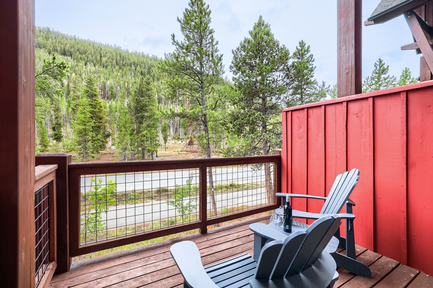 Step onto your private deck and settle into an Adirondack chair, where towering pines and mountain views create your peaceful backdrop for morning coffee or evening relaxation.