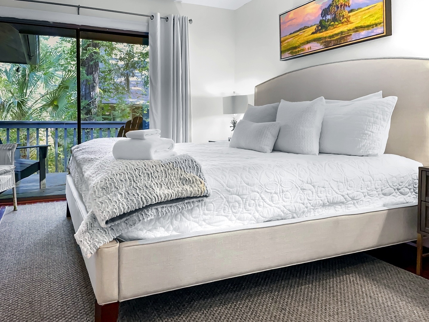 Sink into crisp white linens and plush pillows while tropical views fill your window. Your peaceful retreat awaits.