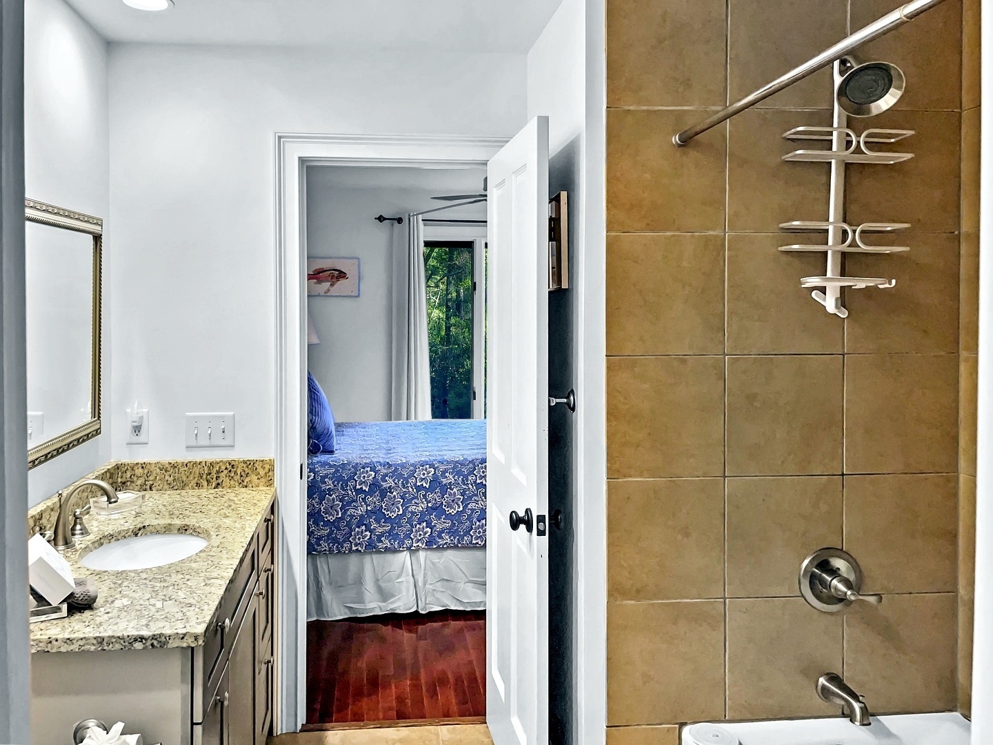 Step into your spa-like bathroom featuring granite countertops and a spacious tiled shower with premium fixtures for refreshing mornings.