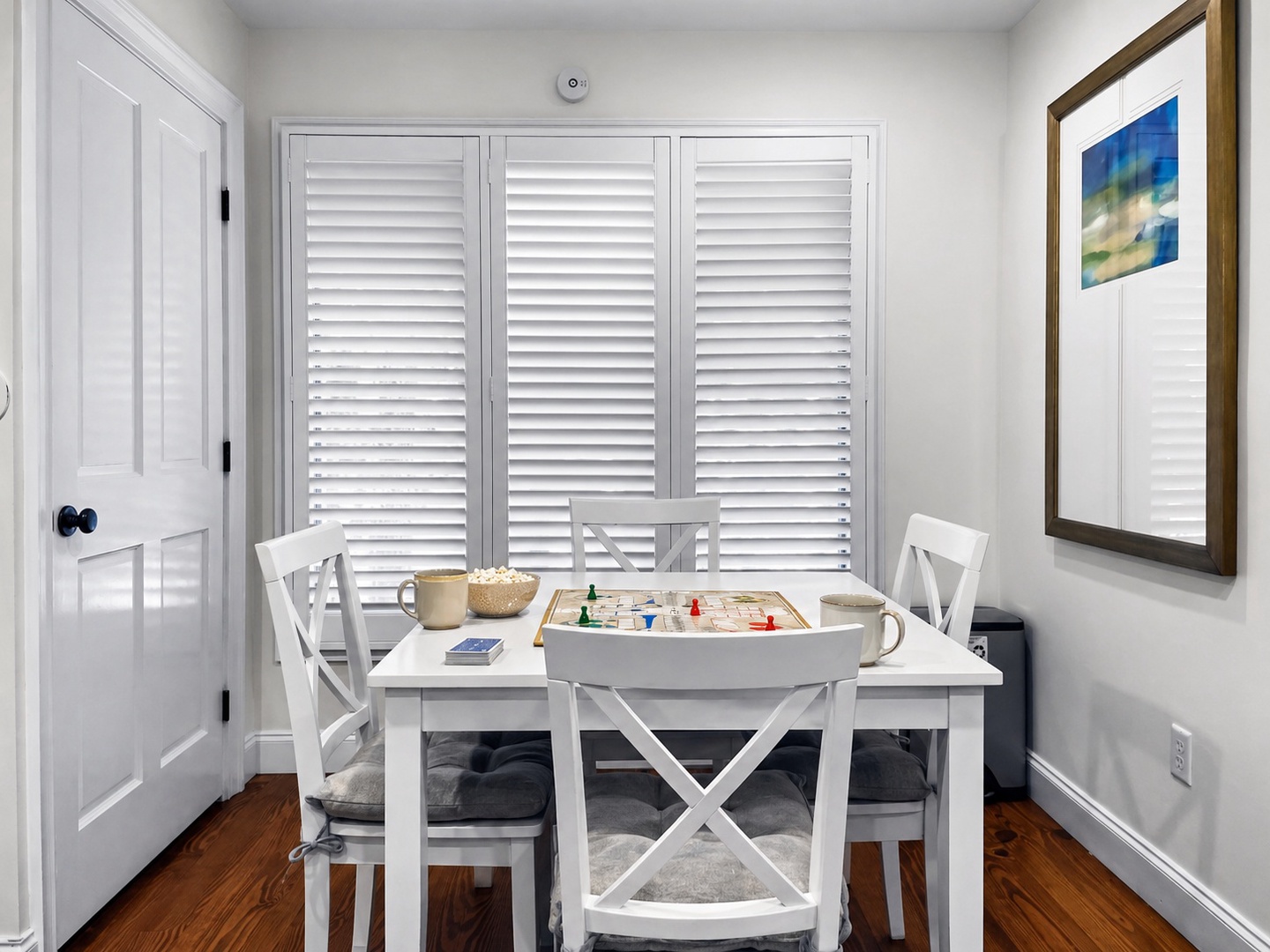 Gather around your bright dining nook for morning coffee or family game night. The white table and chairs create a cheerful spot for meals.