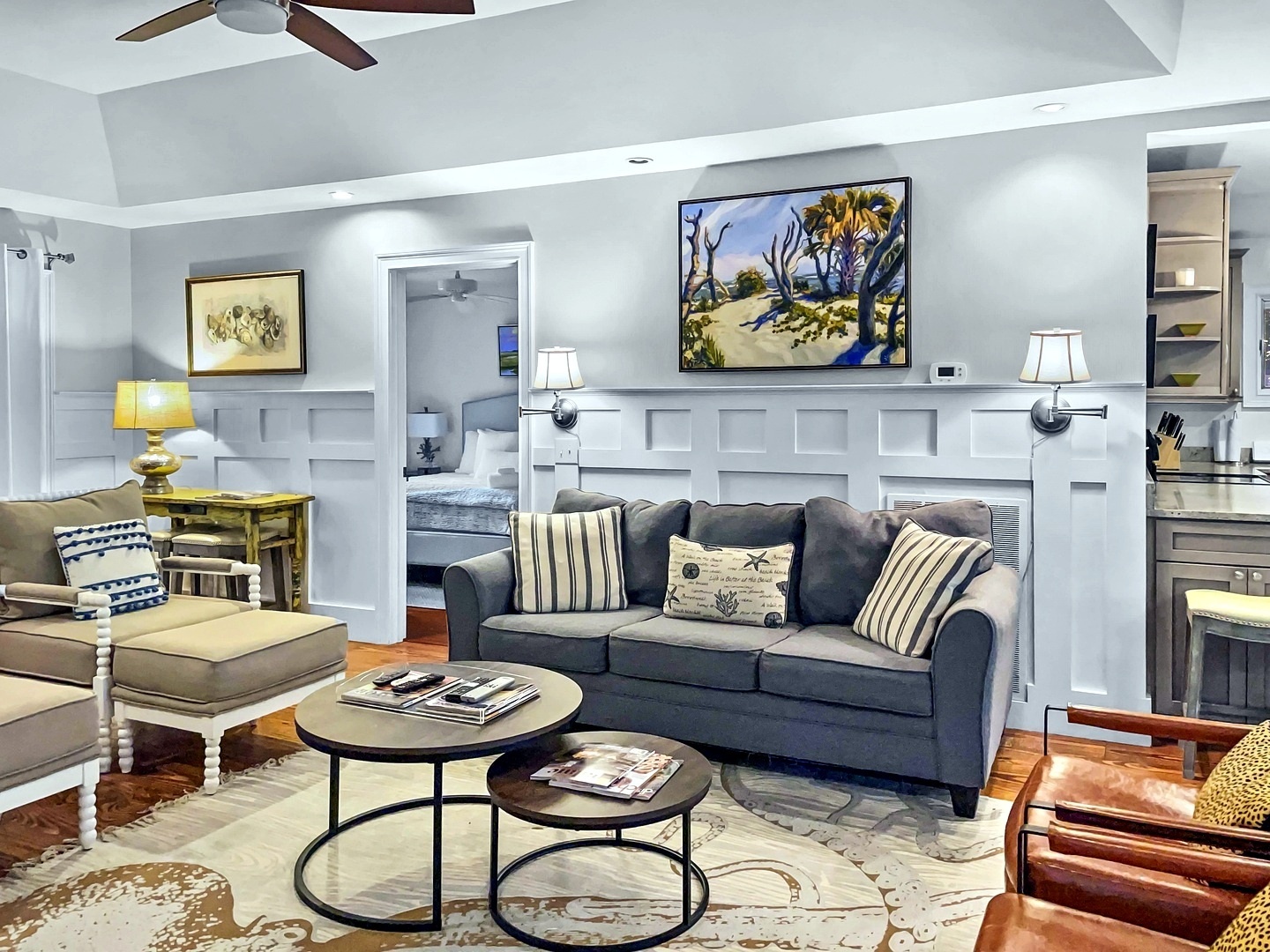 Sink into your comfortable living space with elegant wainscoting, artwork, and a cozy fireplace to unwind by after your adventures.