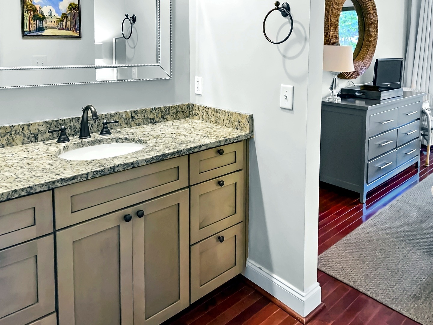 Your elegant ensuite bathroom features granite countertops, spacious vanity storage, and modern fixtures for a luxurious start to each day.