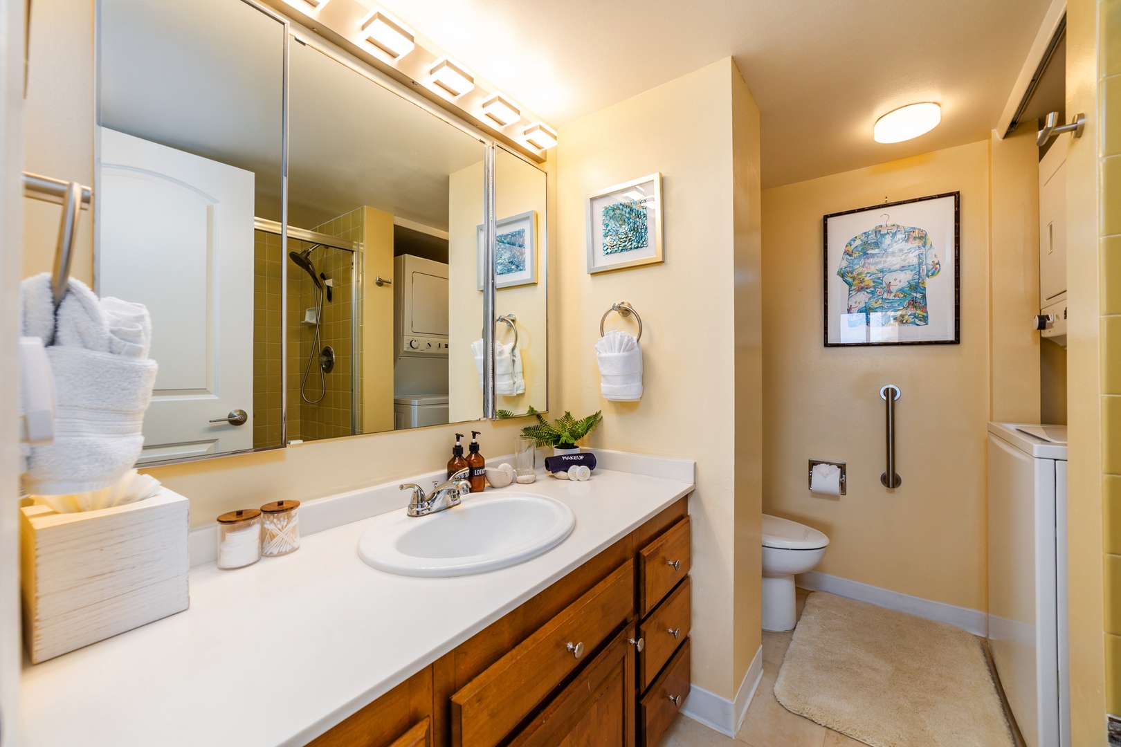 Your private bathroom features a spacious vanity with ample storage, plush towels, a walk-in shower with a handheld showerhead, and thoughtful accessibility features for your comfort.
