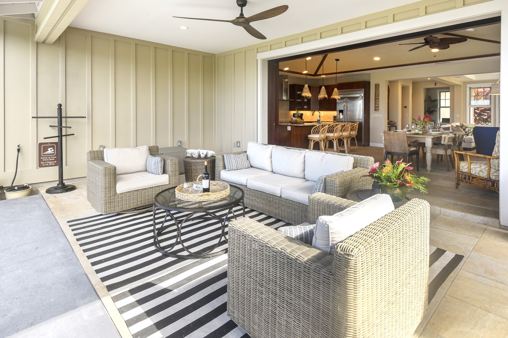 Unwind in your large lanai with plush wicker seating and an open flow to the gourmet kitchen.