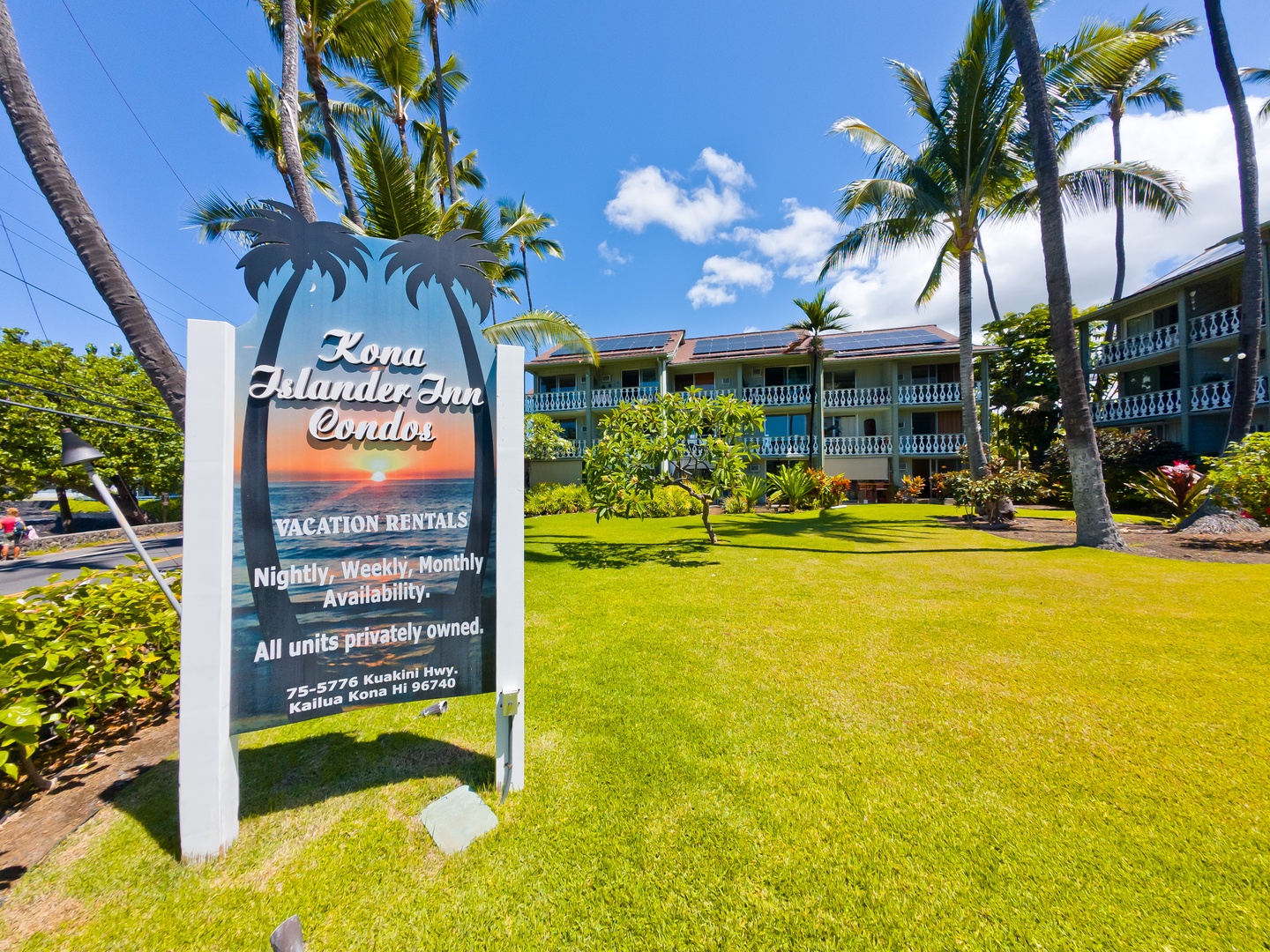 Kona Islander Inn Condos stands amid tropical landscaping and swaying palms, offering vacation rentals with nightly, weekly, and monthly availability in beautiful Kailua Kona, Hawaii.
