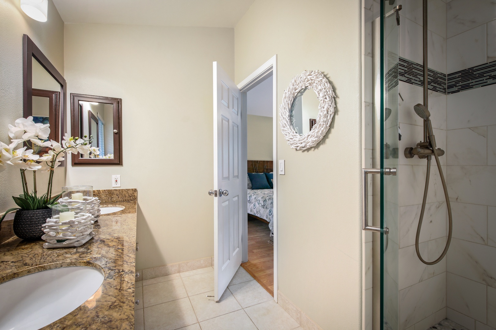 Step into your private ensuite with granite counters, a walk-in shower, and coastal-inspired decor welcoming you to unwind after a day of adventure.
