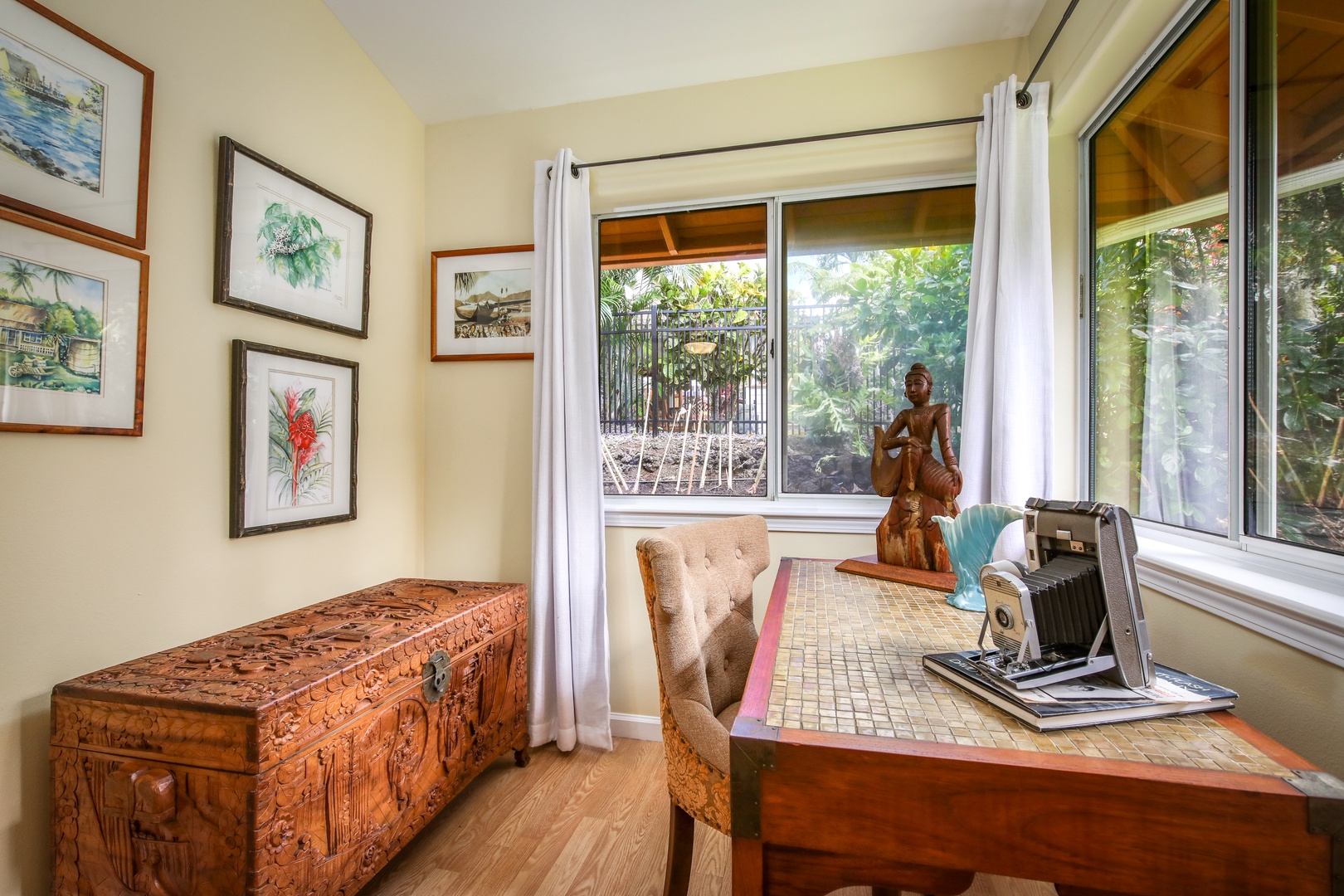 Settle into your cozy workspace corner with garden views and thoughtful island-inspired decor. Natural light floods your private nook, perfect for planning adventures or quiet reflection.