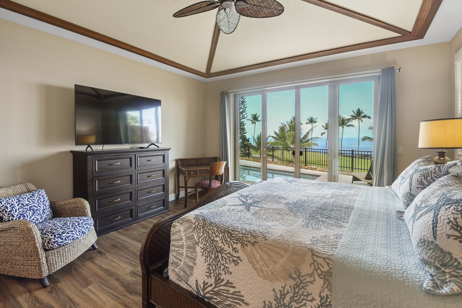 Wake up to stunning ocean views with swaying palms from your tropical bedroom sanctuary, complete with comfortable seating and modern amenities.