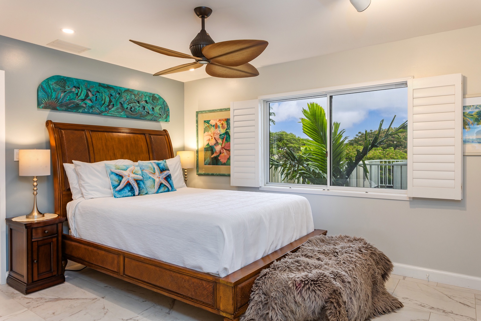 Drift into peaceful dreams in your coastal retreat, where tropical breezes and lush greenery greet you each morning through your window.