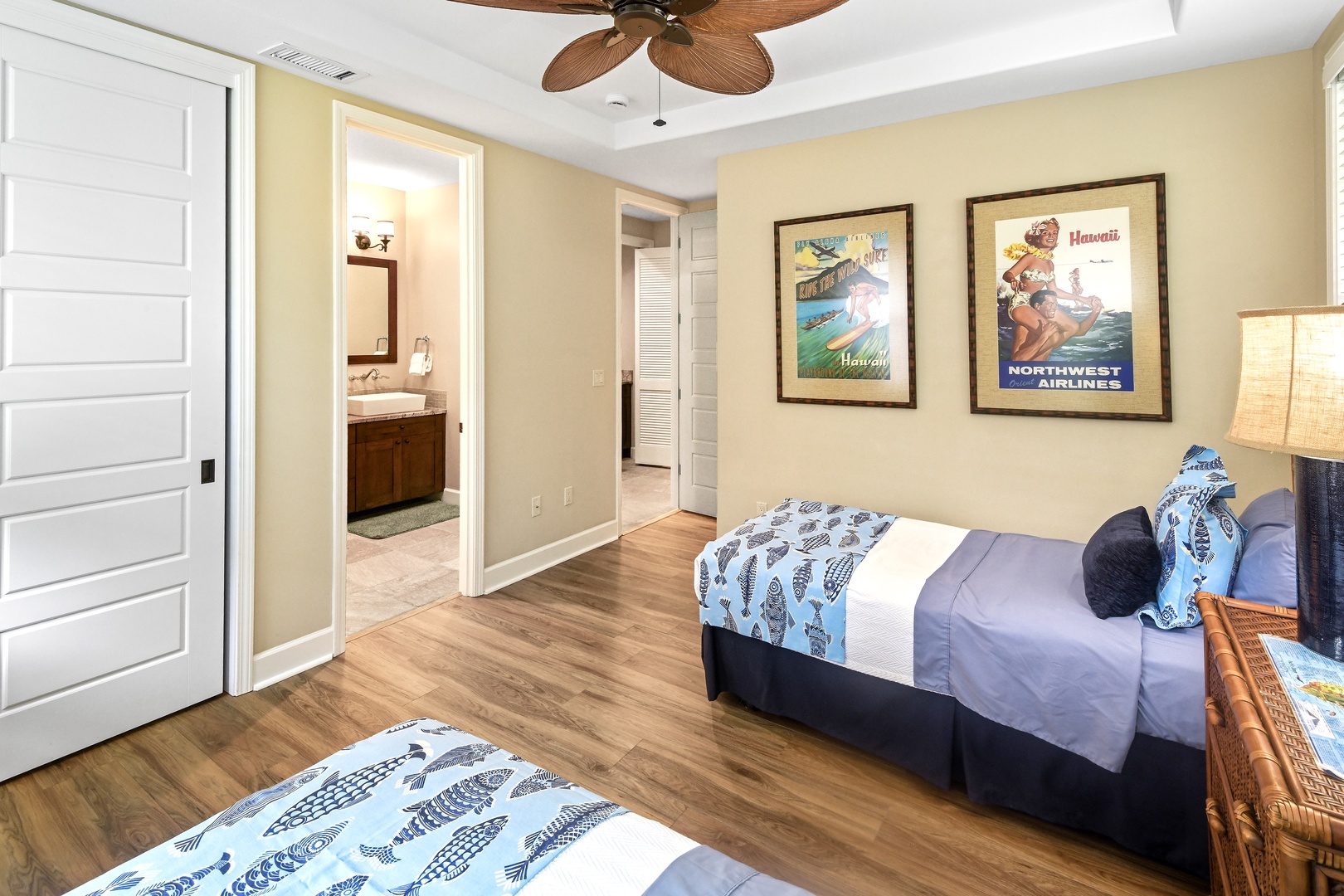 Drift into island dreams in your cozy bedroom with tropical touches, ceiling fan, and connected bathroom.