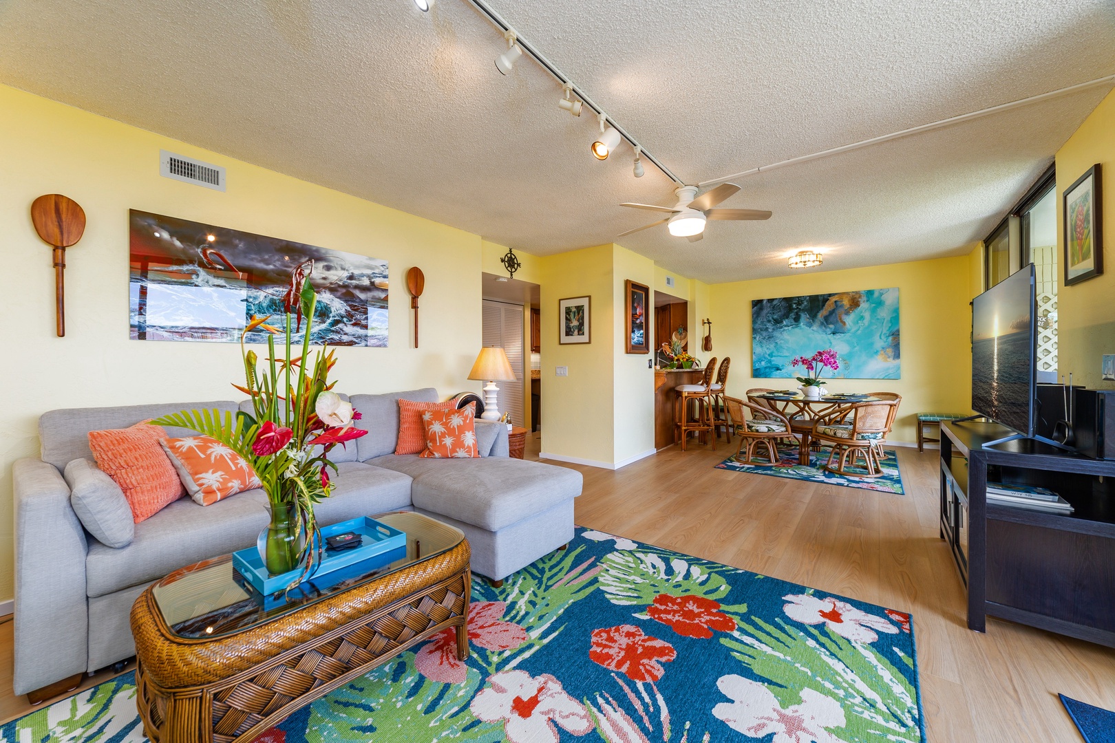 Sink into the cozy sectional and soak in the cheerful island-inspired décor. Bright tropical hues, woven furniture, and lush florals create a breezy, welcoming vibe perfect for unwinding after your adventures.
