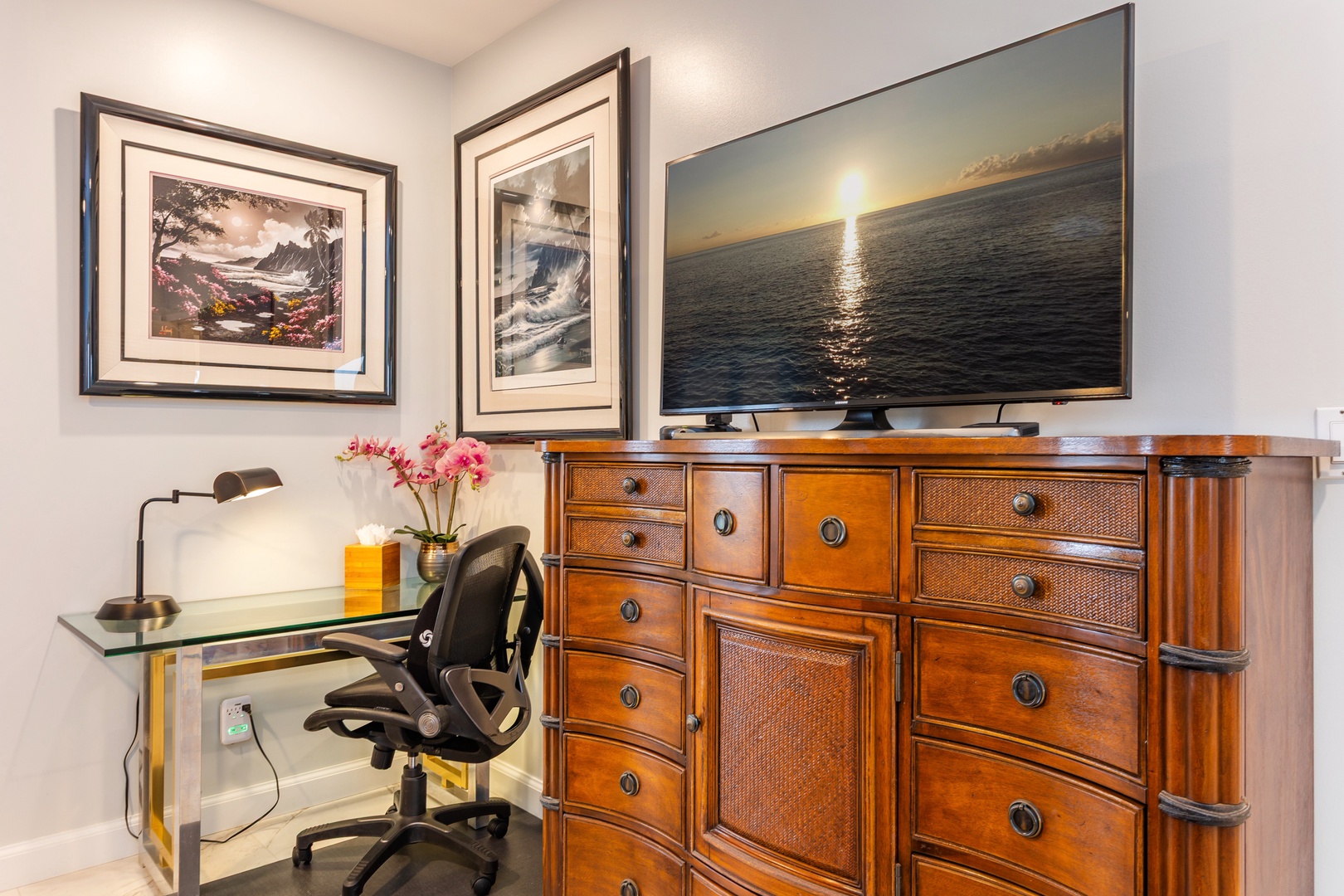 Settle in at the glass desk or unwind with your favorite shows on the large flat-screen TV. The classic wood dresser provides ample storage for all your belongings.