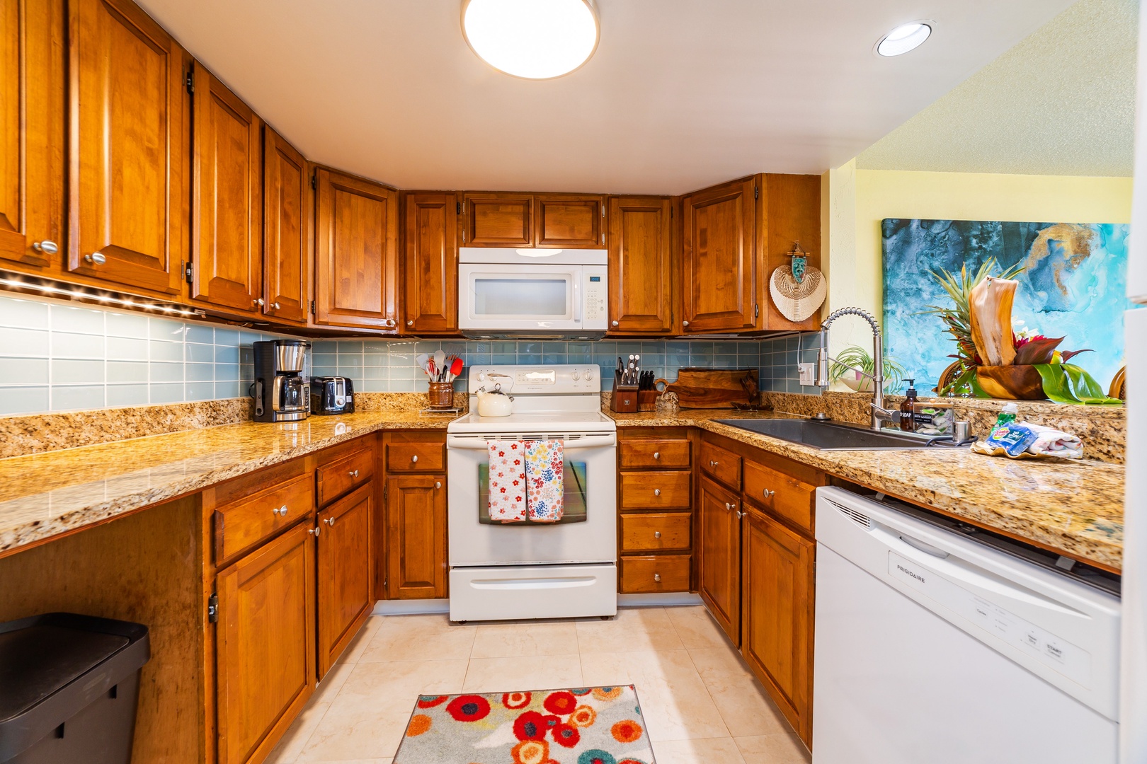 Your spacious, fully equipped kitchen invites you to prepare island-inspired meals, complete with granite countertops, warm wood cabinetry, and all the appliances and cookware you need for a comfortable stay.