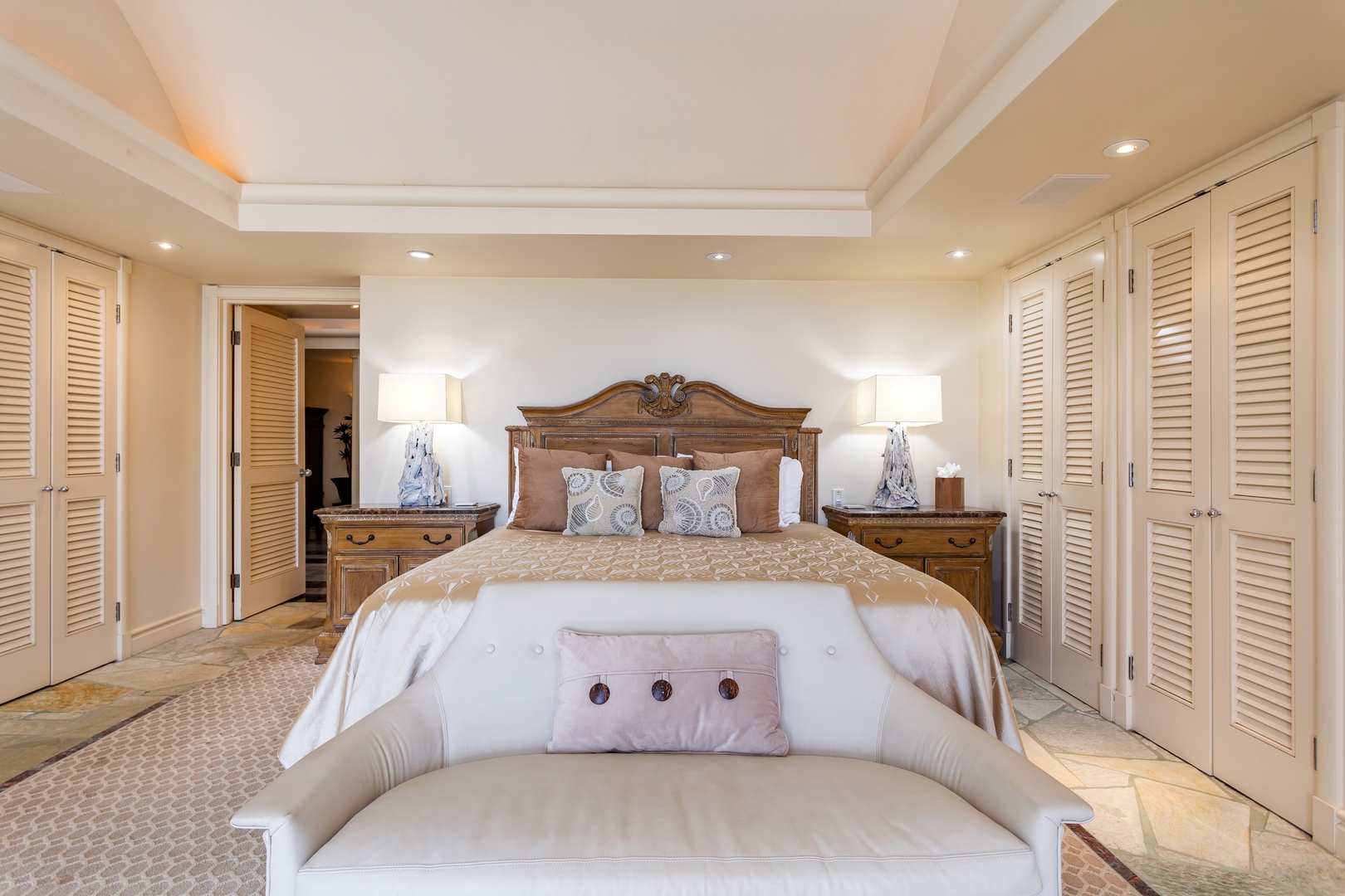 Primary Bedroom - Step into your serene retreat with a beautifully appointed king bed, elegant furnishings, and soft lighting that creates the perfect ambiance for rest and relaxation.