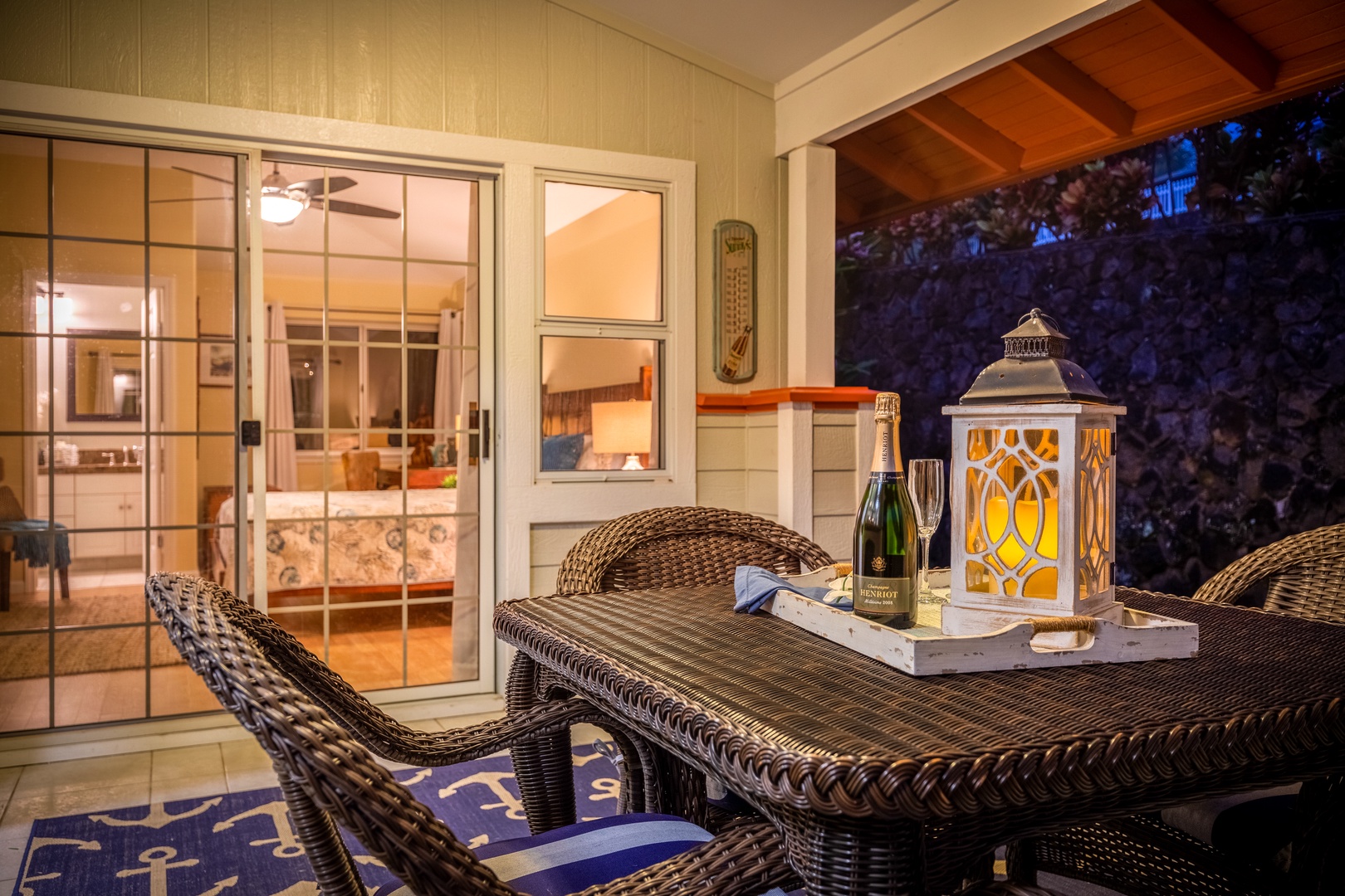 Picture yourself unwinding on your private patio with champagne and soft lantern glow, the perfect end to your day. Seamless indoor-outdoor living awaits you here.
