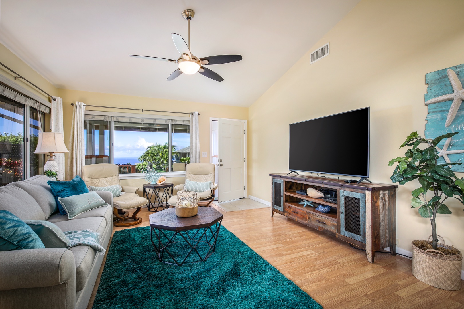 Unwind in your coastal-inspired living room where plush seating and ocean breezes through open windows create the perfect spot for your morning coffee or evening relaxation.