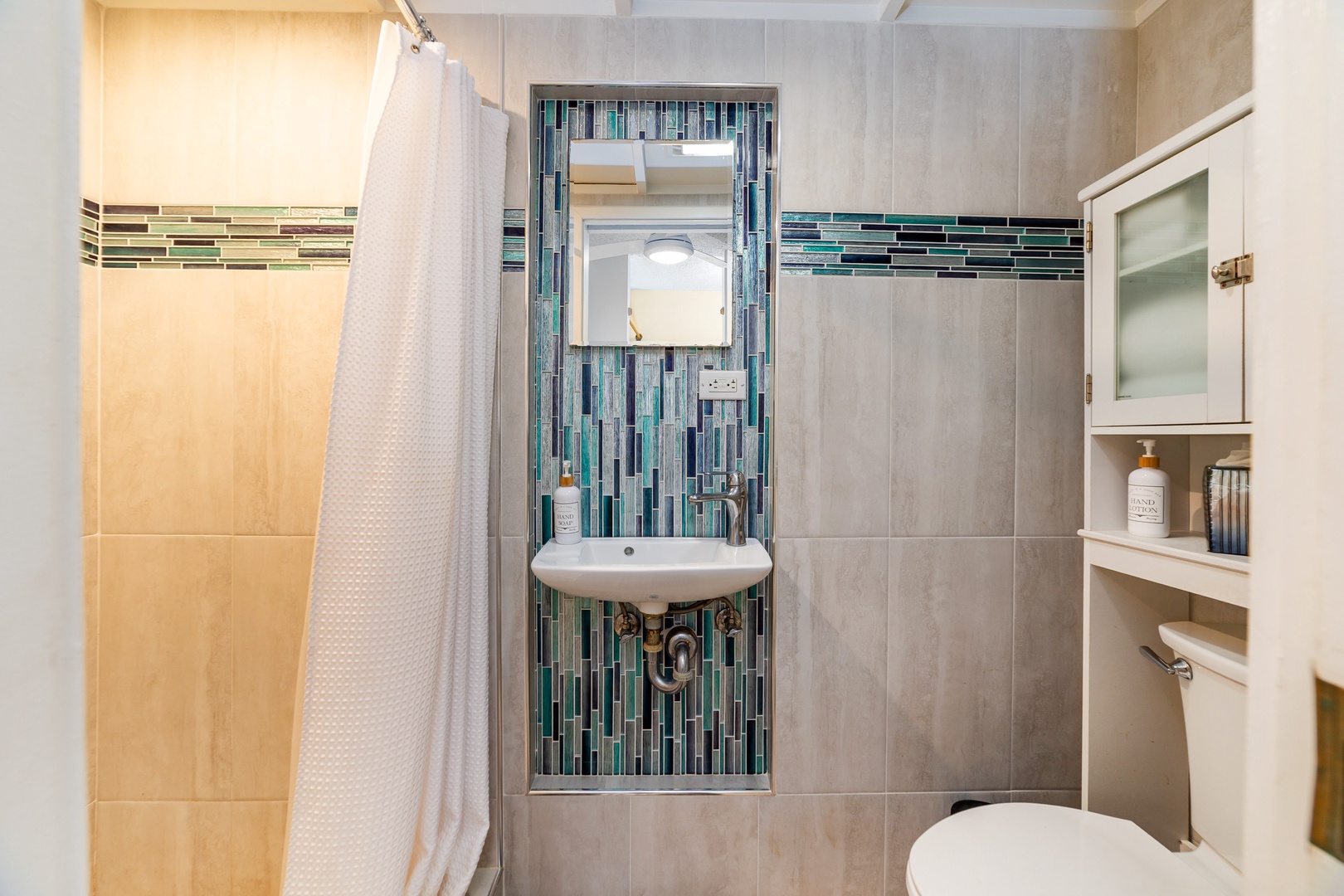 Step into your private bathroom, where soothing tile and a walk-in shower invite you to refresh after a day of adventure.