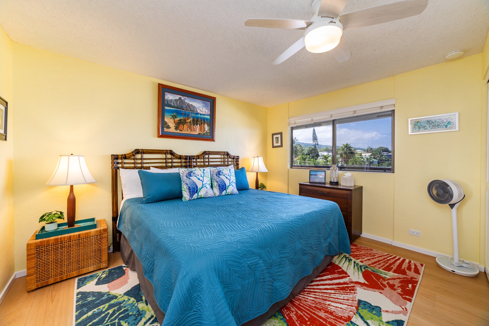 Drift off in your cheerful island-style bedroom, with bright turquoise bedding and tropical touches. Palm trees and ocean vistas through your window complete the peaceful escape.