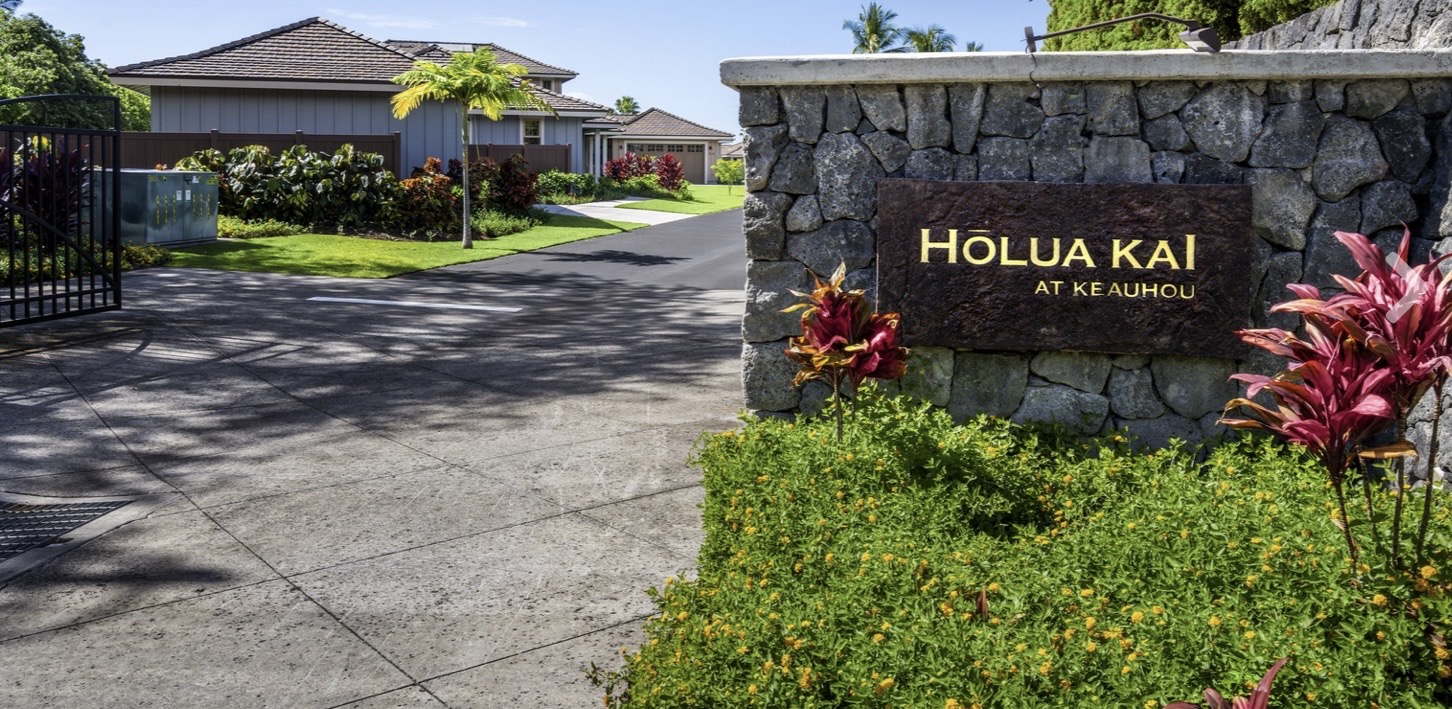 Arrive at Holua Kai, where tropical elegance meets modern comfort through this beautifully landscaped entrance.