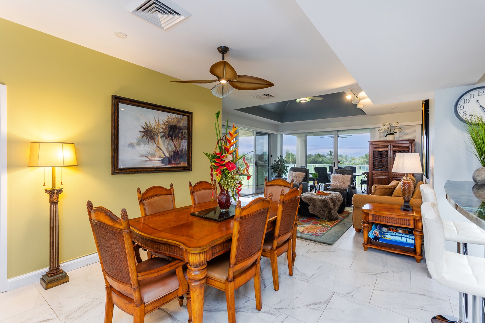 Gather around the elegant dining table where shared meals become cherished memories. Beyond, your inviting living space opens to a private balcony offering serene outdoor views.