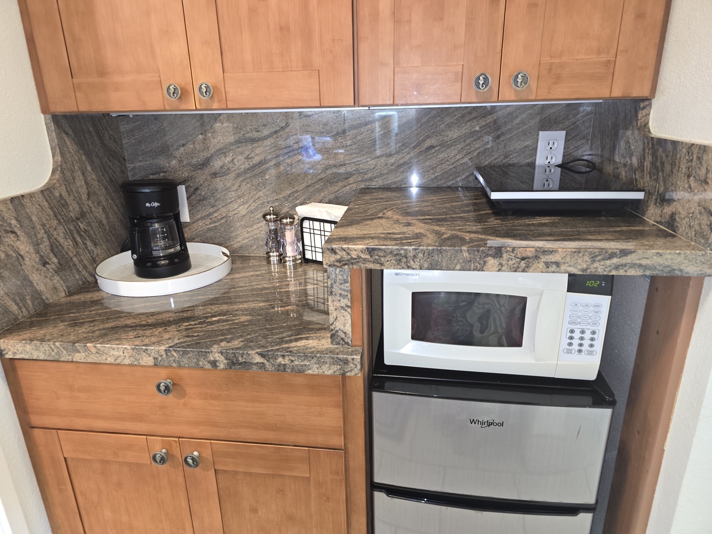 Your compact kitchenette has everything you need with granite counters, coffee maker, and modern appliances for easy meal prep.