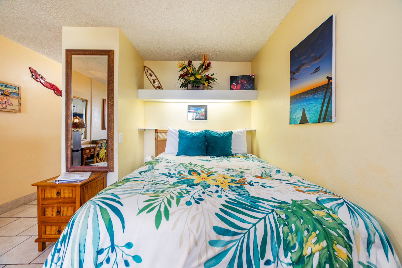 Drift off in your tropical-themed bedroom with cheerful island artwork and lush palm-inspired bedding that brings the beach vibe right to your pillow.